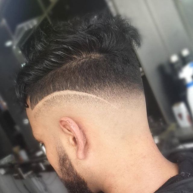Fresh skin fade with a hard part design